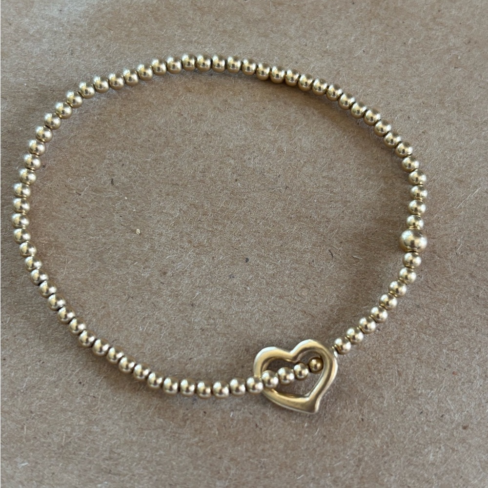 Like new gold Enewton classic gold 2mm bracelet love charm